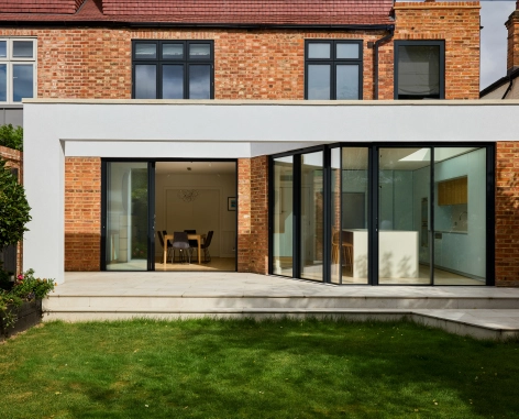 architect-detail-full-width-of-back-of-house-r10-builders-kitchen-Sky-blue-house